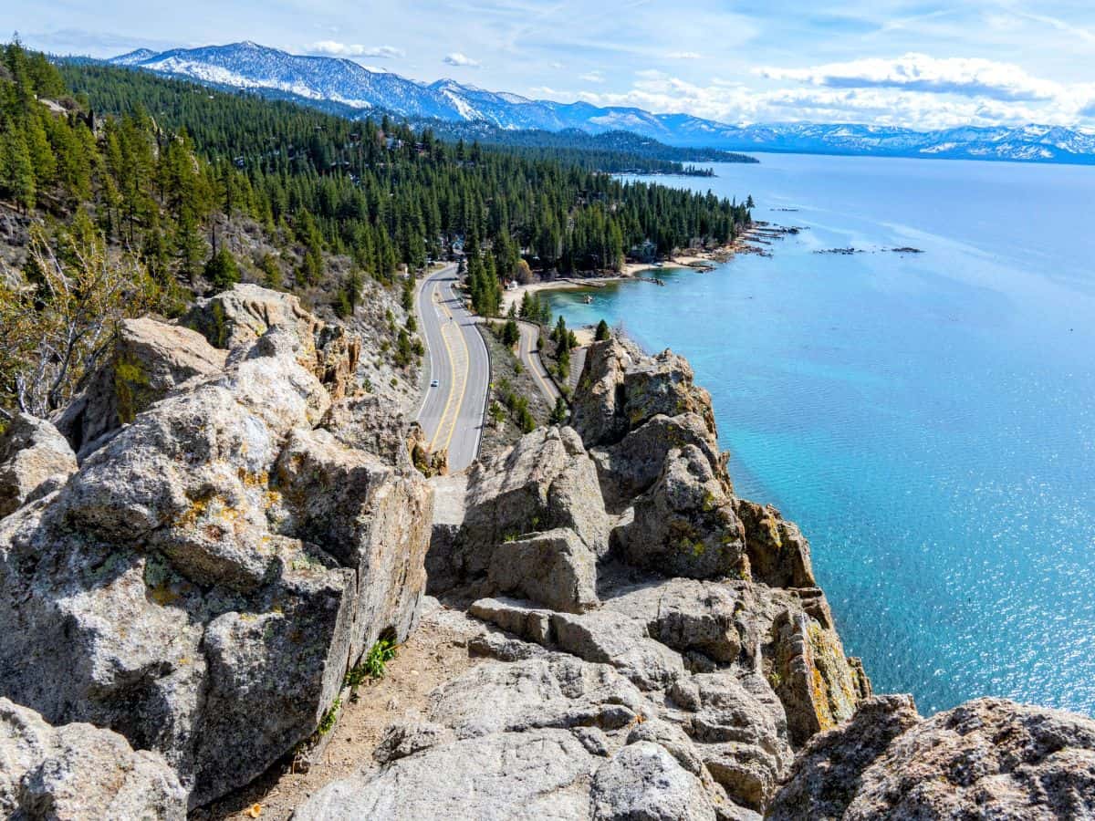 The rugged Cave Rock Trail offers breathtaking views of the turquoise waters of Lake Tahoe and the winding road below. This short and accessible hike is one of the 11 Easy Lake Tahoe Hikes To Do, perfect for taking in the lake's natural beauty.