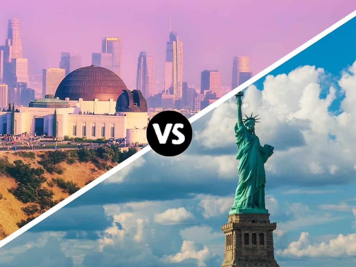 A split image showing two iconic cityscapes. On the left, the Griffith Observatory overlooks the Los Angeles skyline under a pinkish sky, while on the right, the Statue of Liberty stands tall against a blue sky filled with clouds. The central "VS" suggests a comparison between Los Angeles vs New York City.