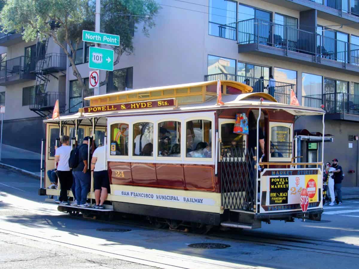 A classic San Francisco cable car on Powell & Hyde Streets, capturing the city's unique public transportation system, offering a contrast to the more expansive network found in Los Angeles in the "San Francisco vs Los Angeles" transportation discussion.