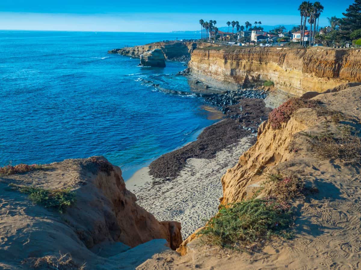 The Sunset Cliffs Trail offers dramatic ocean views with rugged cliffs and a sandy trail along the coastline, ideal for scenic dog-friendly hikes in San Diego.
