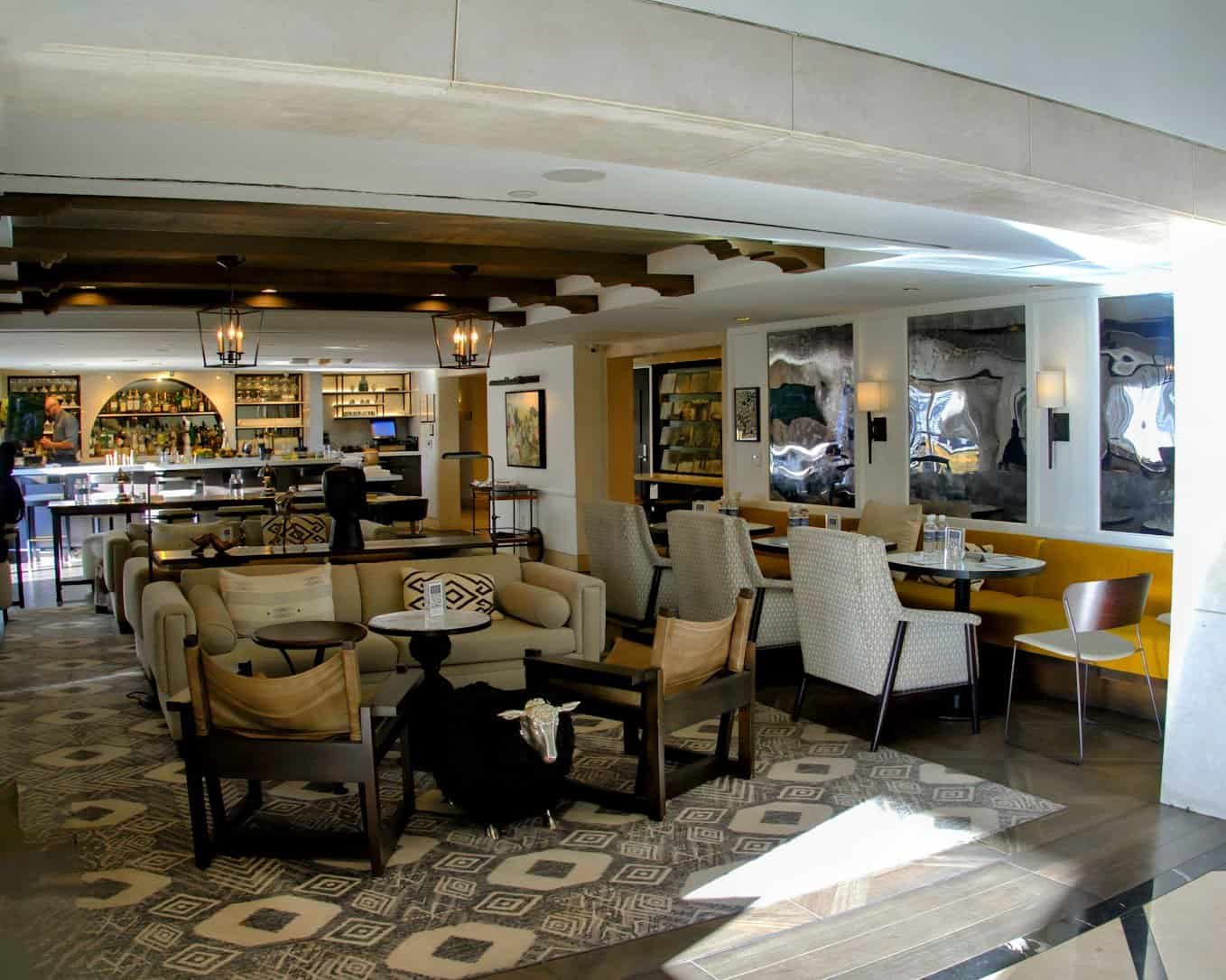 A chic and inviting lounge area at Hotel Amarano in Los Angeles, showcasing stylish seating, contemporary decor, and a warm, relaxed atmosphere.