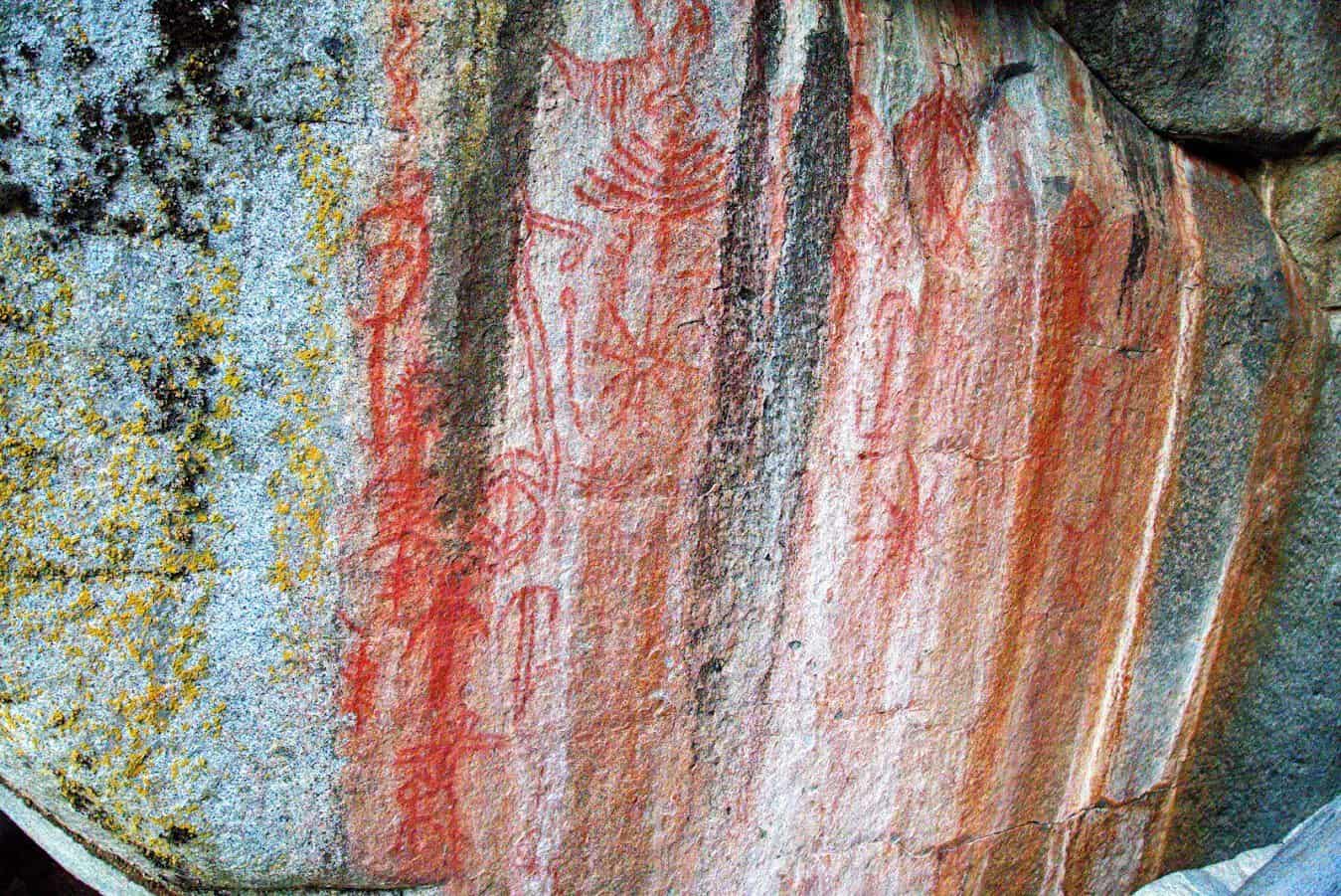 Close-up of a rock surface with ancient pictographs suggesting a historical  site significant to indigenous tribes.