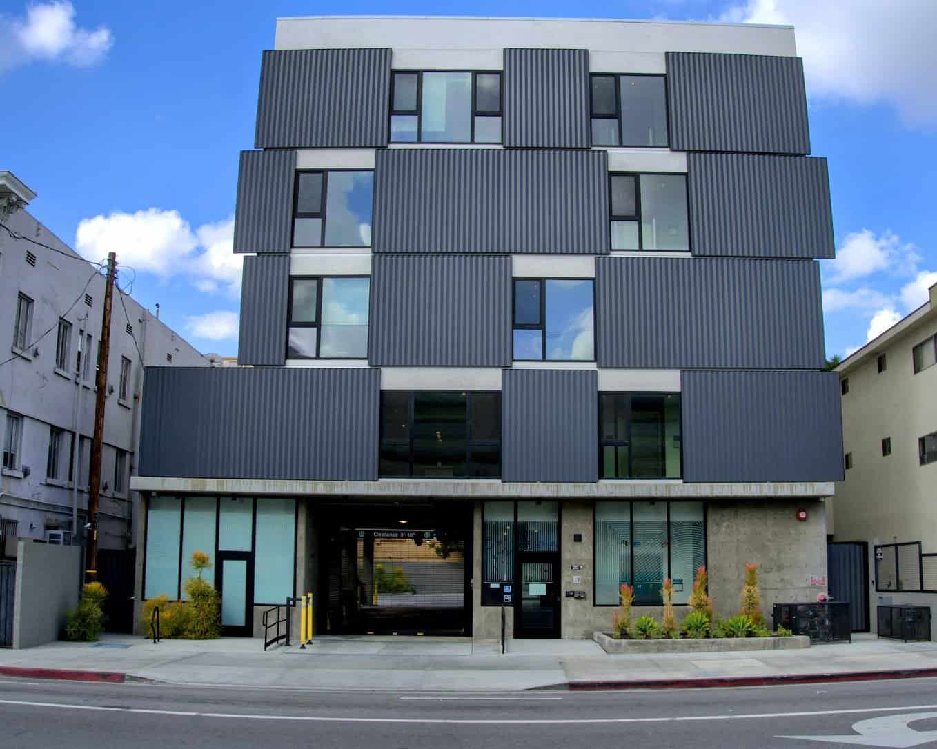 The striking exterior of The Metric Hotel in Los Angeles, with contemporary architectural design and bold geometric patterns.