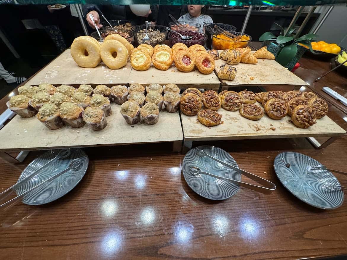 Display of an assortment of freshly baked pastries and doughnuts available at Seaview Restaurant, one of the best Seaport Village restaurants for breakfast or brunch