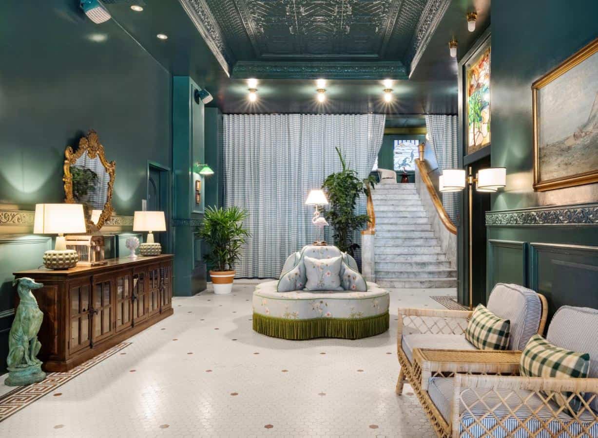 A fancy hotel lobby with shiny floors and comfy seats in Palihotel, one of the best hotels to stay in Gaslamp Quarter San Diego.