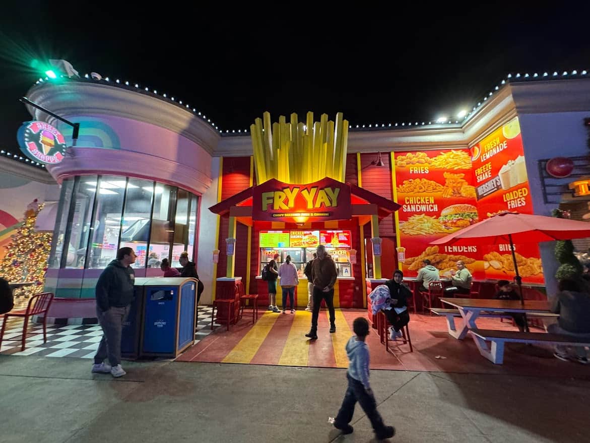 The vibrant and colorful exterior of Fry Yay, a food stand at Belmont Park, serving a variety of fried foods, adding a delicious culinary stop to the list of things to do in Belmont Park, Mission Beach.