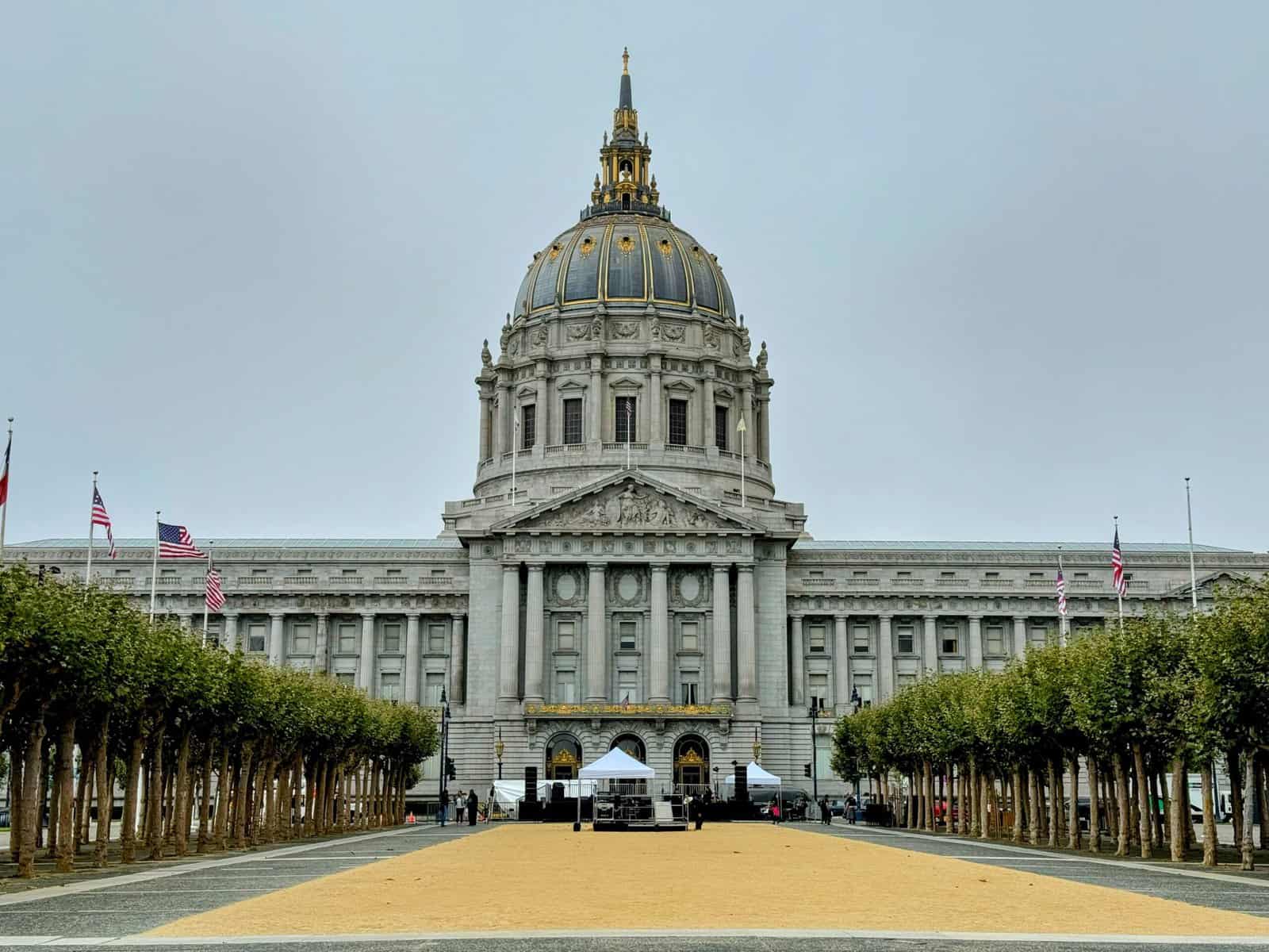 San Francisco City Hall under a clear blue sky. This grand, Beaux-Arts building is a significant architectural landmark and a point of interest for those exploring things to do in San Francisco.
