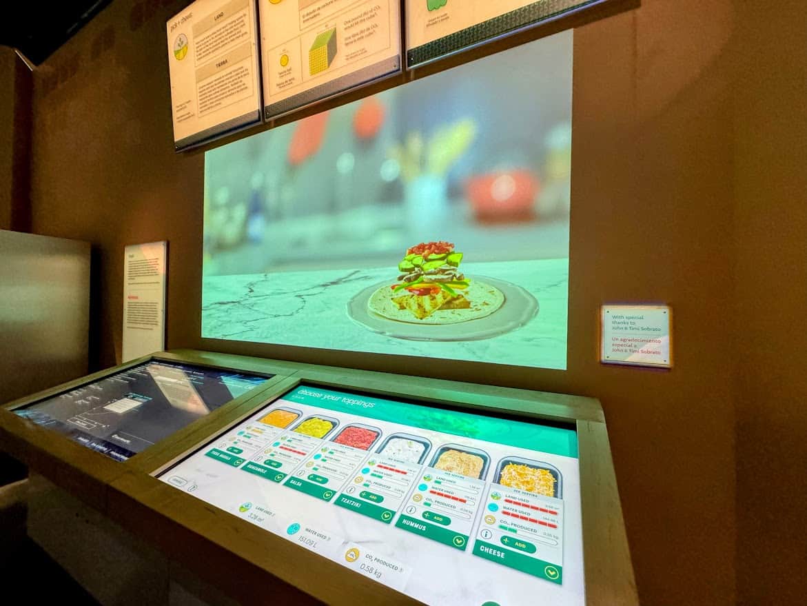 The Pick + Chews exhibit at The Tech Interactive featuring a touch-screen station to build a meal and explore the environmental impact of food choices.
