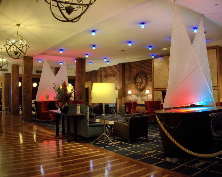 The nautical-themed lobby of the Argonaut Hotel in San Francisco, with ship-inspired decor, cozy seating, and ambient lighting that evokes a seaside retreat.