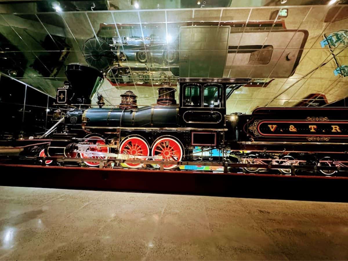 A shiny vintage black and red steam locomotive sits on display inside the California State Railroad Museum, a must-see from the 32 Things To Do In Sacramento guide.