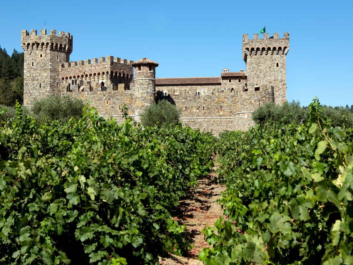 The grand Castello di Amorosa winery in Napa Valley, with its medieval stone walls and vineyard setting, looks like a castle straight from Tuscany, Italy.