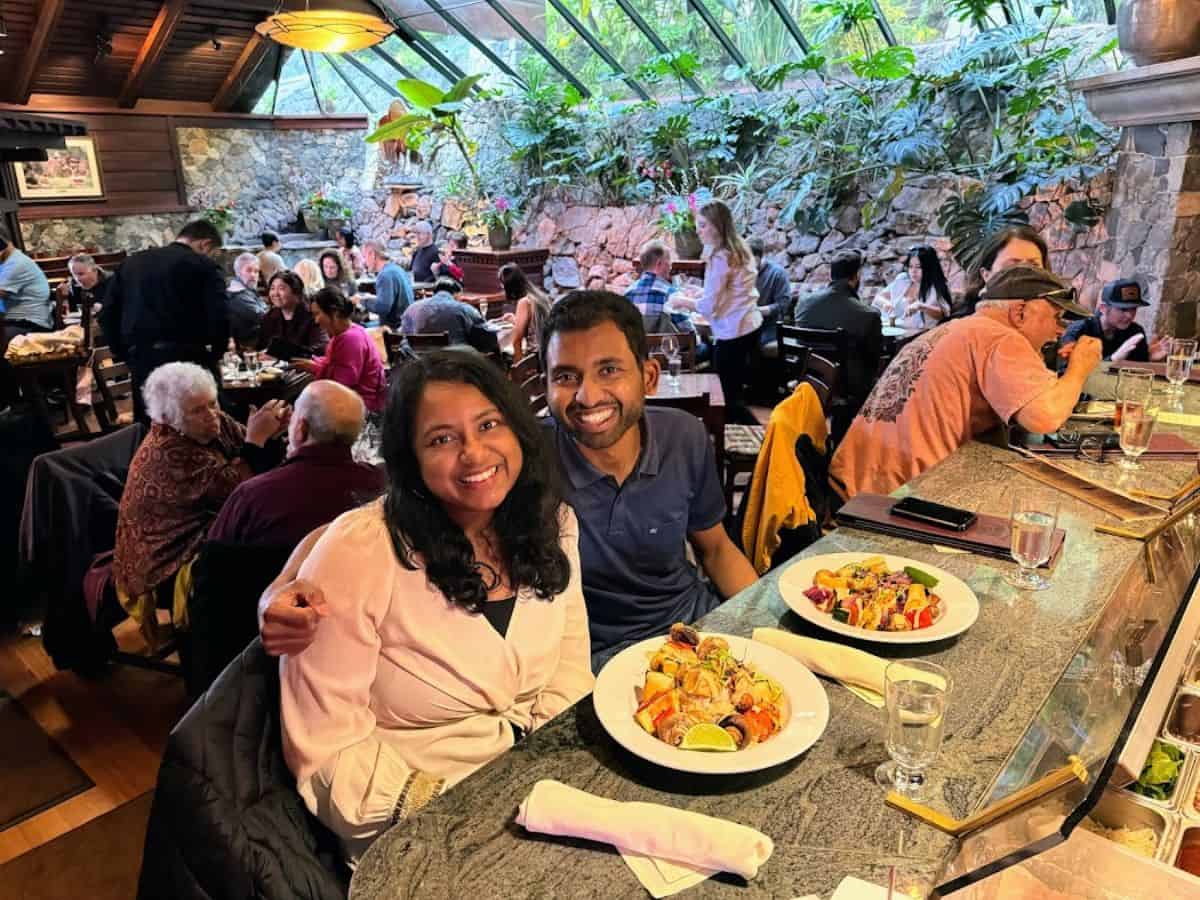 A cozy, upscale dining experience inside Shadowbrook Restaurant, with lush greenery and warm lighting. Enjoying a romantic meal here is a highlight among the 21 Things to Do in Santa Cruz.