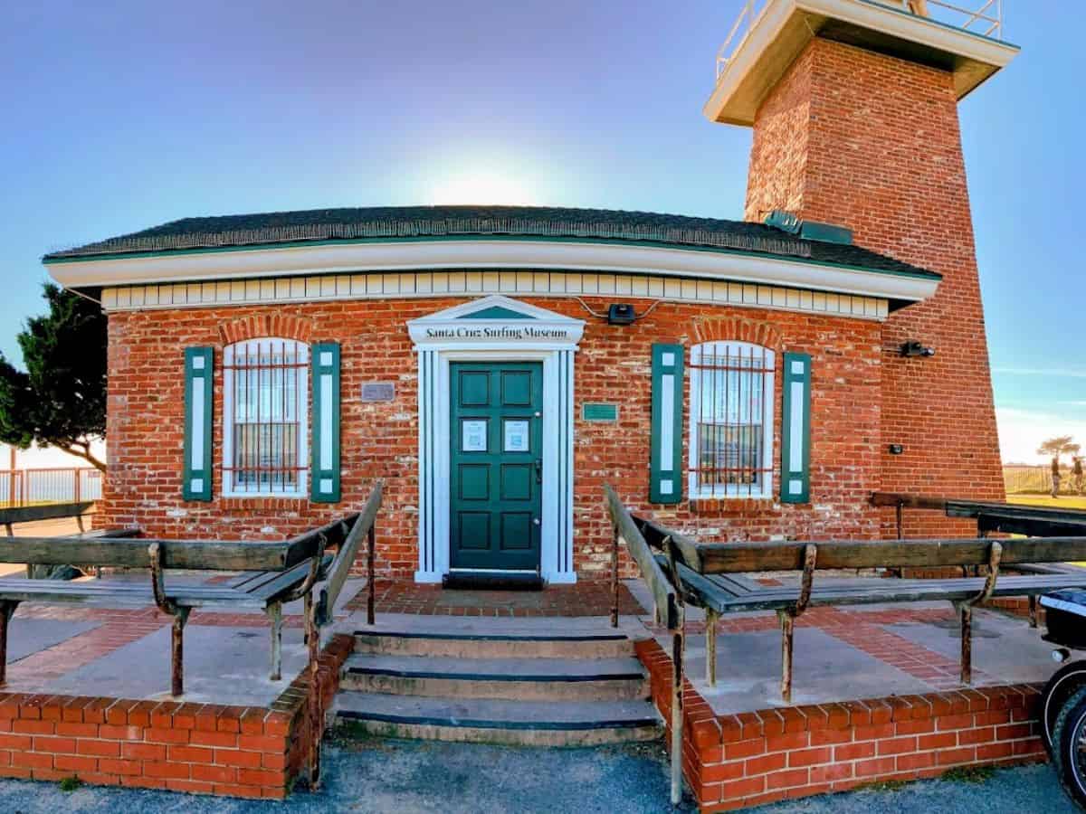 A quaint red-brick lighthouse houses the Santa Cruz Surfing Museum, with ocean views in the background. Learning about the rich history of surfing here is one of the best 21 Things to Do in Santa Cruz.