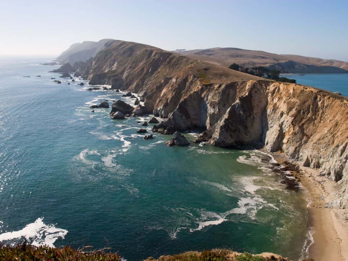The dramatic coastal cliffs of Point Reyes, with their jagged edges and crashing waves, bear a striking resemblance to Ireland’s Cliffs of Moher.