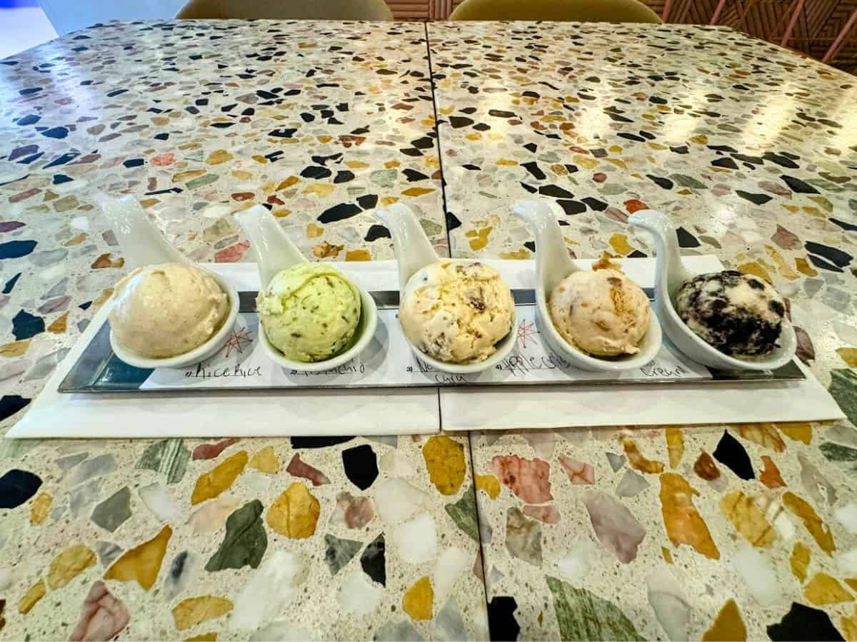 A flight of house-made ice creams in ceramic tasting spoons lines a terrazzo table at Erosion Tap House, with flavors like pistachio, fig, and guava. It’s a fun, unexpected gem among the 17 best places to eat in Napa Valley.