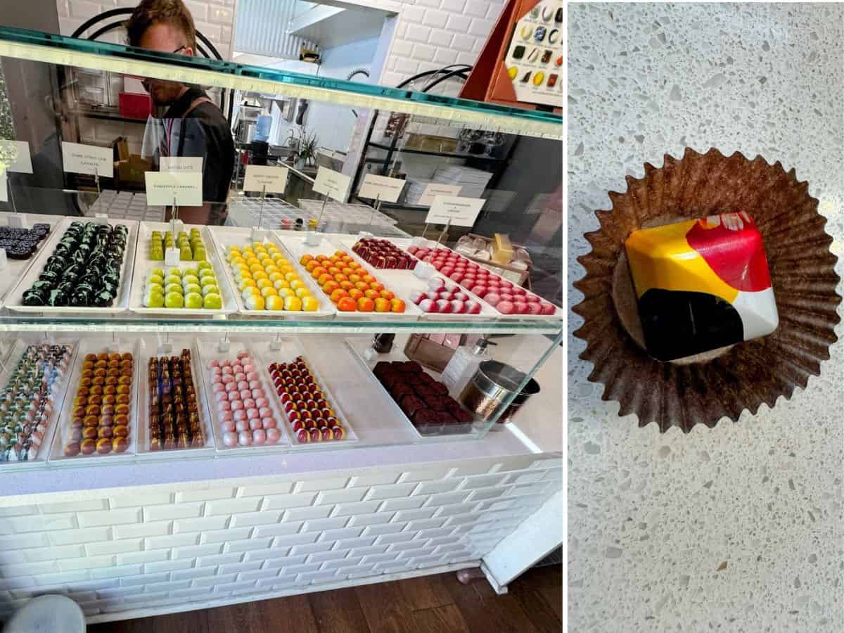 An elegant chocolate shop display at Earth & Sky Chocolates showcases rows of glossy confections, including pineapple caramel and dark citrus lime, plus a close-up of an abstractly painted bonbon in a paper cup. A boutique chocolatier experience that secures its place on the list of the 17 best places to eat in Napa Valley.