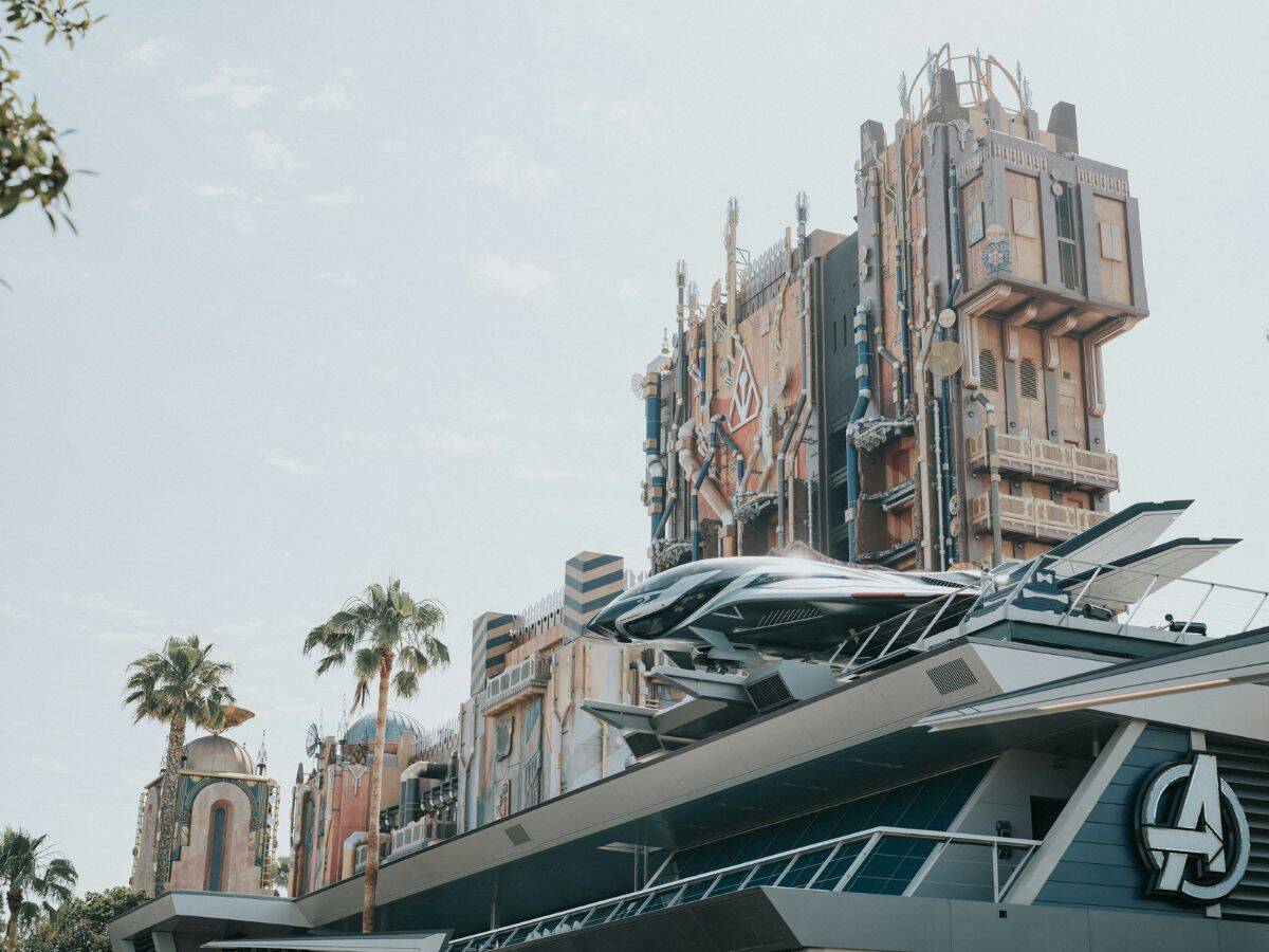 Futuristic Avengers Campus building with a sleek Quinjet on top and Guardians of the Galaxy – Mission: Breakout! towering in the background at Disney California Adventure.