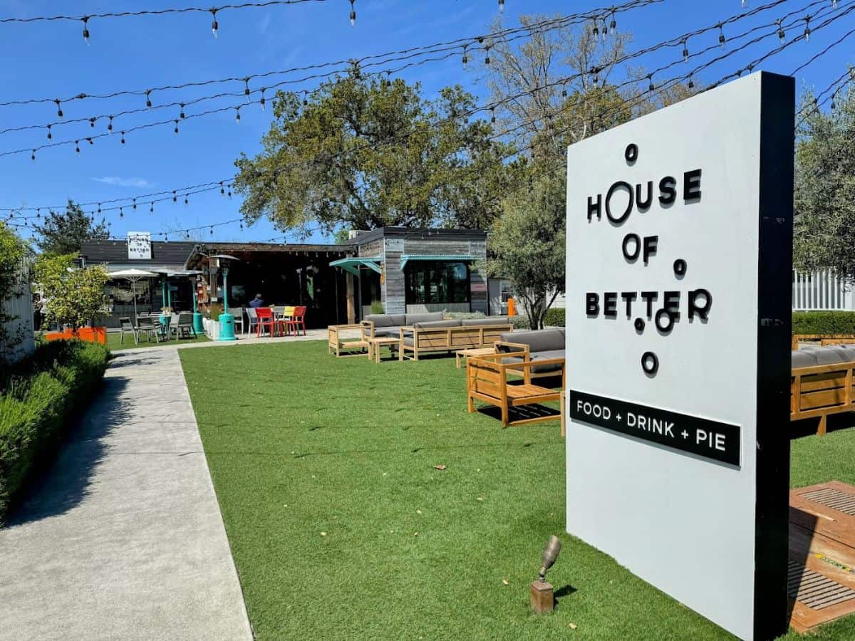 Outdoor seating area and sign for House of Better, a local eatery serving food, drinks, and pie, perfect for relaxing and dining among things to do in Calistoga.