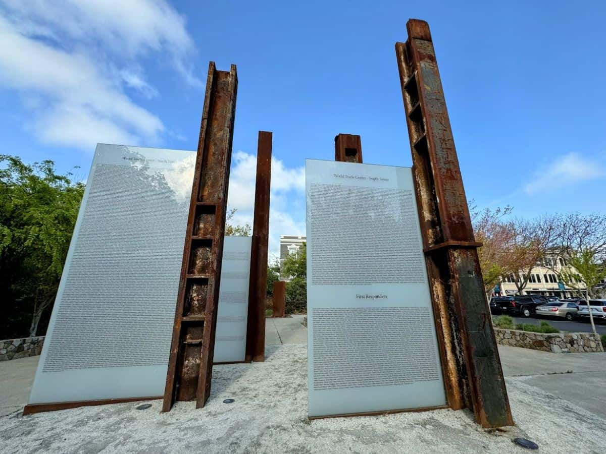 Steel beams from the World Trade Center rise beside engraved glass panels at the Napa 9/11 Memorial Garden—a somber and reflective space included in the 17 things to do in Napa.