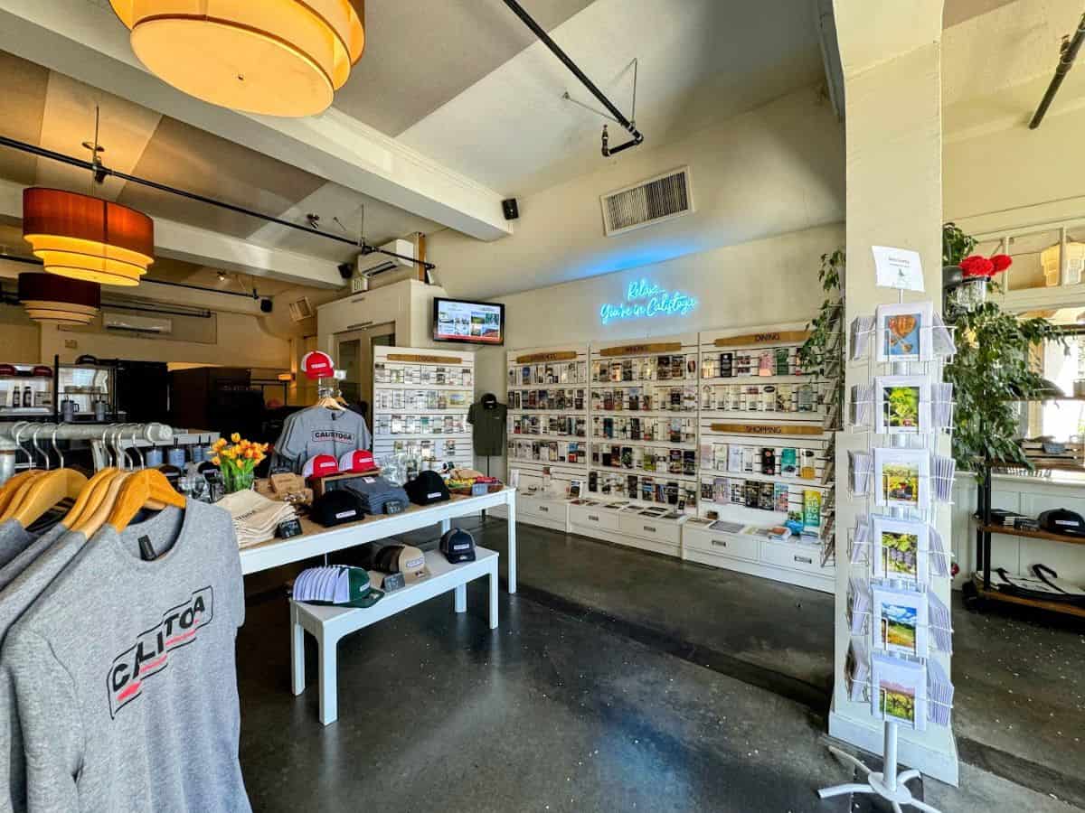  Inside the Calistoga Welcome Center featuring visitor brochures, maps, and local merchandise under a neon “Relax, You’re in Calistoga” sign, making it a smart first stop on your list of things to do in Calistoga.