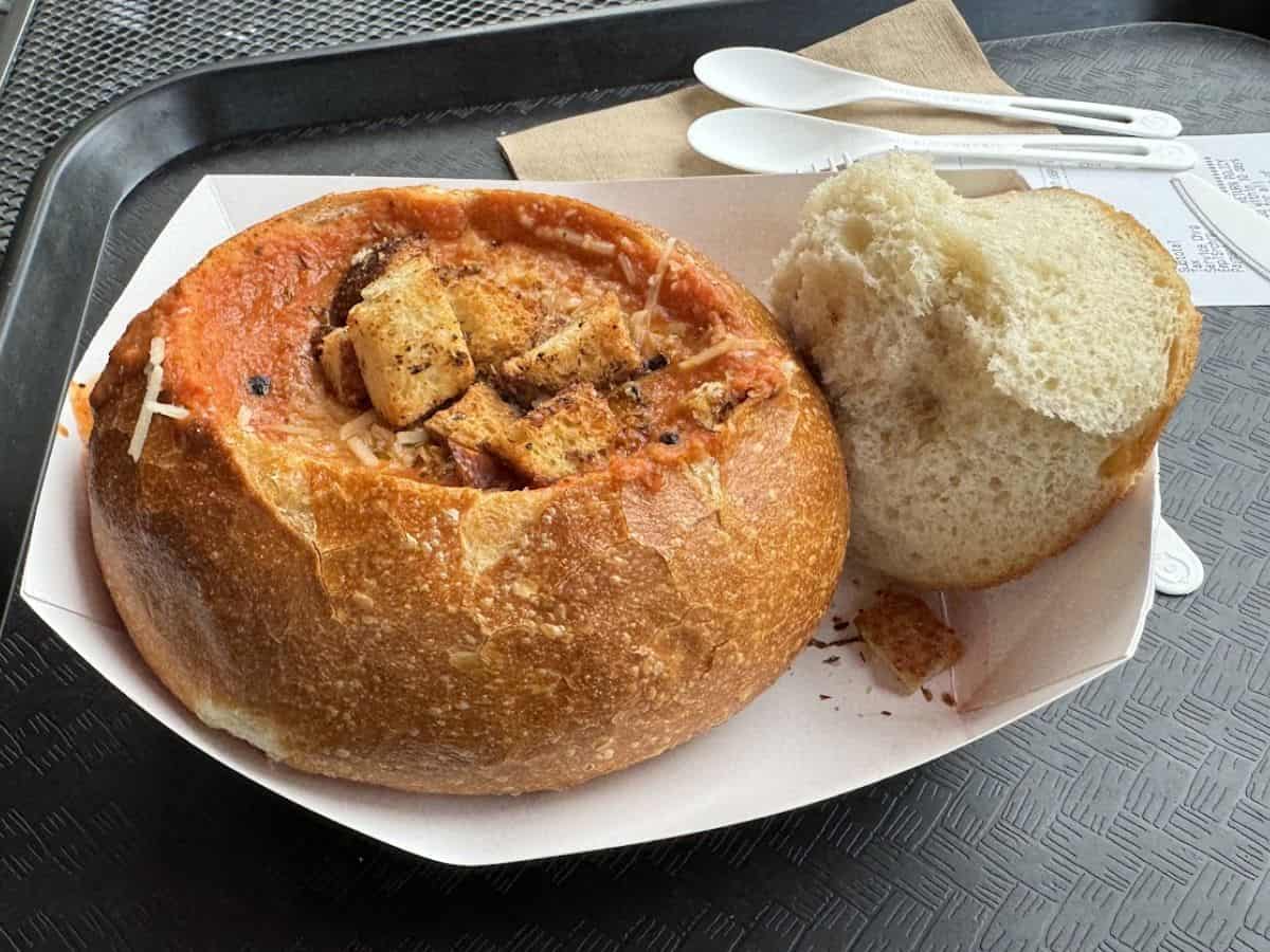 A sourdough bread bowl filled with creamy clam chowder at Boudin Bakery, one of the Best Spots to eat in San Francisco.