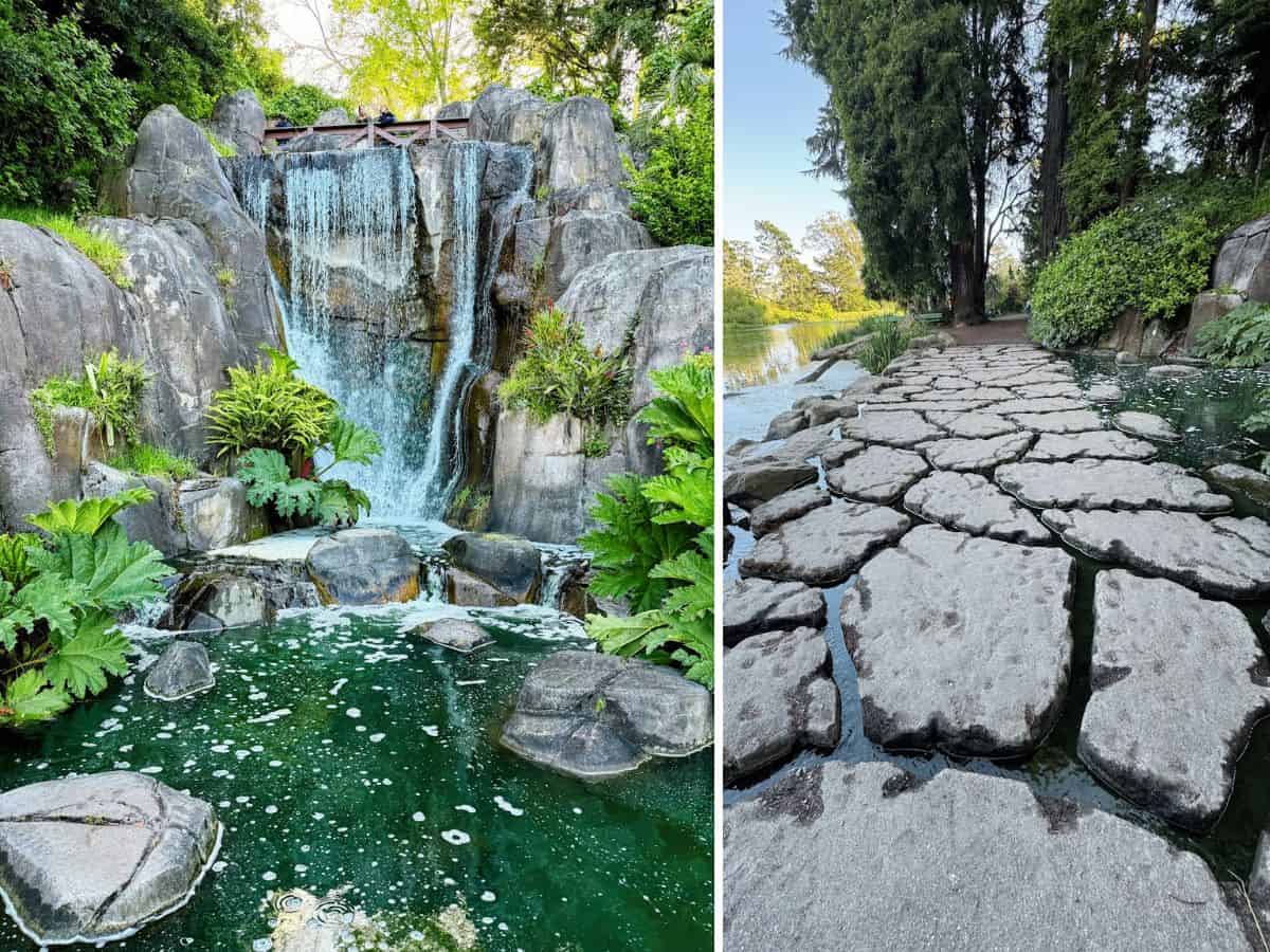 Serene waterfall with lush greenery and cascading water in a natural park setting.
