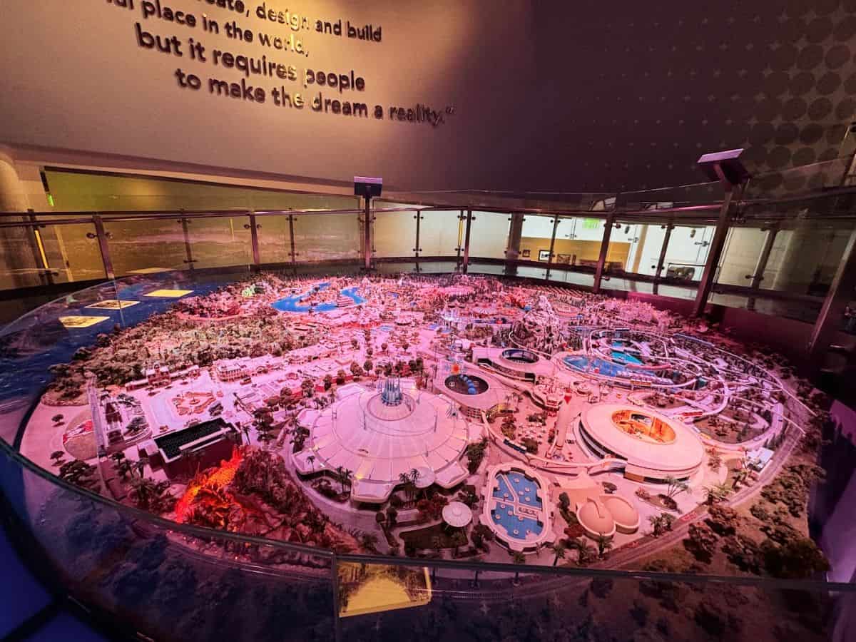 Model of a large amusement park or entertainment complex with roller coasters and water features, highlighting urban development and entertainment venues.